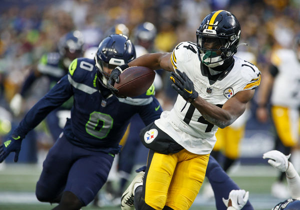 SEATTLE, WA - DECEMBER 31: Pittsburgh Steelers wide receiver George Pickens (14) runs with the ball during the game between the Pittsburgh Steelers and the Seattle Seahawks on December 31, 2023 at Lumen Field in Seattle, WA. (Photo by Oliver McKenna/Icon Sportswire)