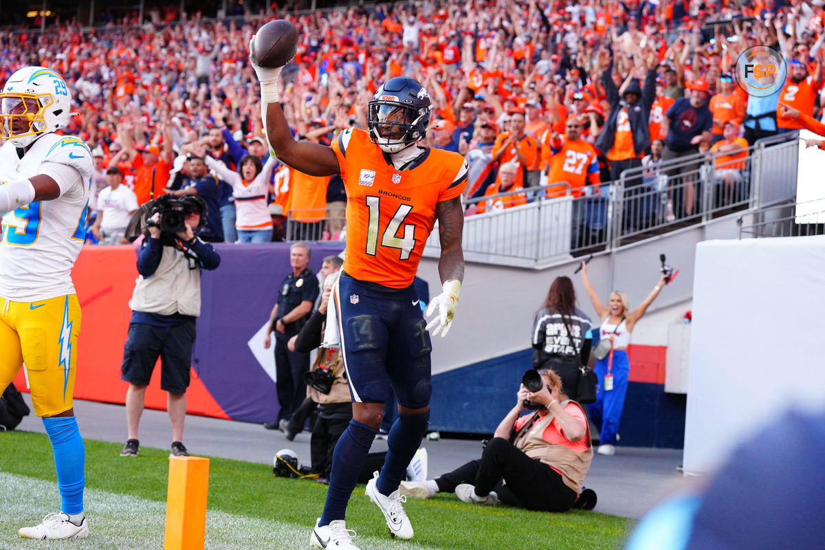 Oct 13, 2024; Denver, Colorado, USA; Denver Broncos wide receiver Courtland Sutton (14) celebrates his touchdown reception in the second half against the Los Angeles Chargers at Empower Field at Mile High. Credit: Ron Chenoy-Imagn Images