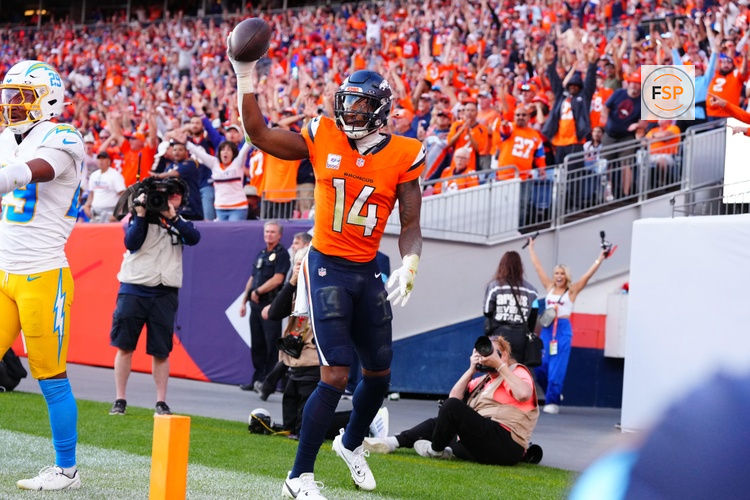 Oct 13, 2024; Denver, Colorado, USA; Denver Broncos wide receiver Courtland Sutton (14) celebrates his touchdown reception in the second half against the Los Angeles Chargers at Empower Field at Mile High. Credit: Ron Chenoy-Imagn Images