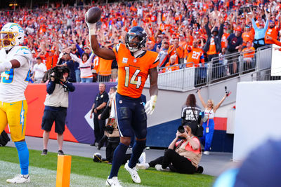 Oct 13, 2024; Denver, Colorado, USA; Denver Broncos wide receiver Courtland Sutton (14) celebrates his touchdown reception in the second half against the Los Angeles Chargers at Empower Field at Mile High. Mandatory Credit: Ron Chenoy-Imagn Images