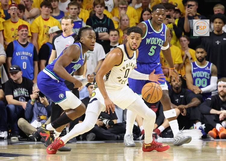 Oct 7, 2026; Ames, Iowa, USA;  Indiana Pacers guard Tyrese Haliburton (0) is defended by Minnesota Timberwolves forward Jonathan Kuminga (24) at James H. Hilton Coliseum.  Credit: Reese Strickland-Imagn Images