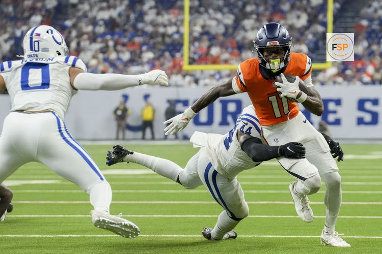 Sep 14, 2025; Indianapolis, Indiana, USA; Indianapolis Colts linebacker Zaire Franklin (44) tackles Denver Broncos wide receiver Troy Franklin (11) at Lucas Oil Stadium. Credit: INDIANAPOLIS STAR-USA TODAY Network via Imagn Images