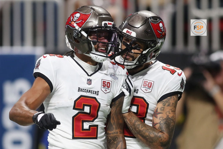Sep 7, 2025; Atlanta, Georgia, USA; Tampa Bay Buccaneers wide receiver Emeka Egbuka (2) celebrates with wide receiver Mike Evans (13) after scoring a touchdown against the Atlanta Falcons during the second quarter at Mercedes-Benz Stadium. Credit: Brett Davis-Imagn Images