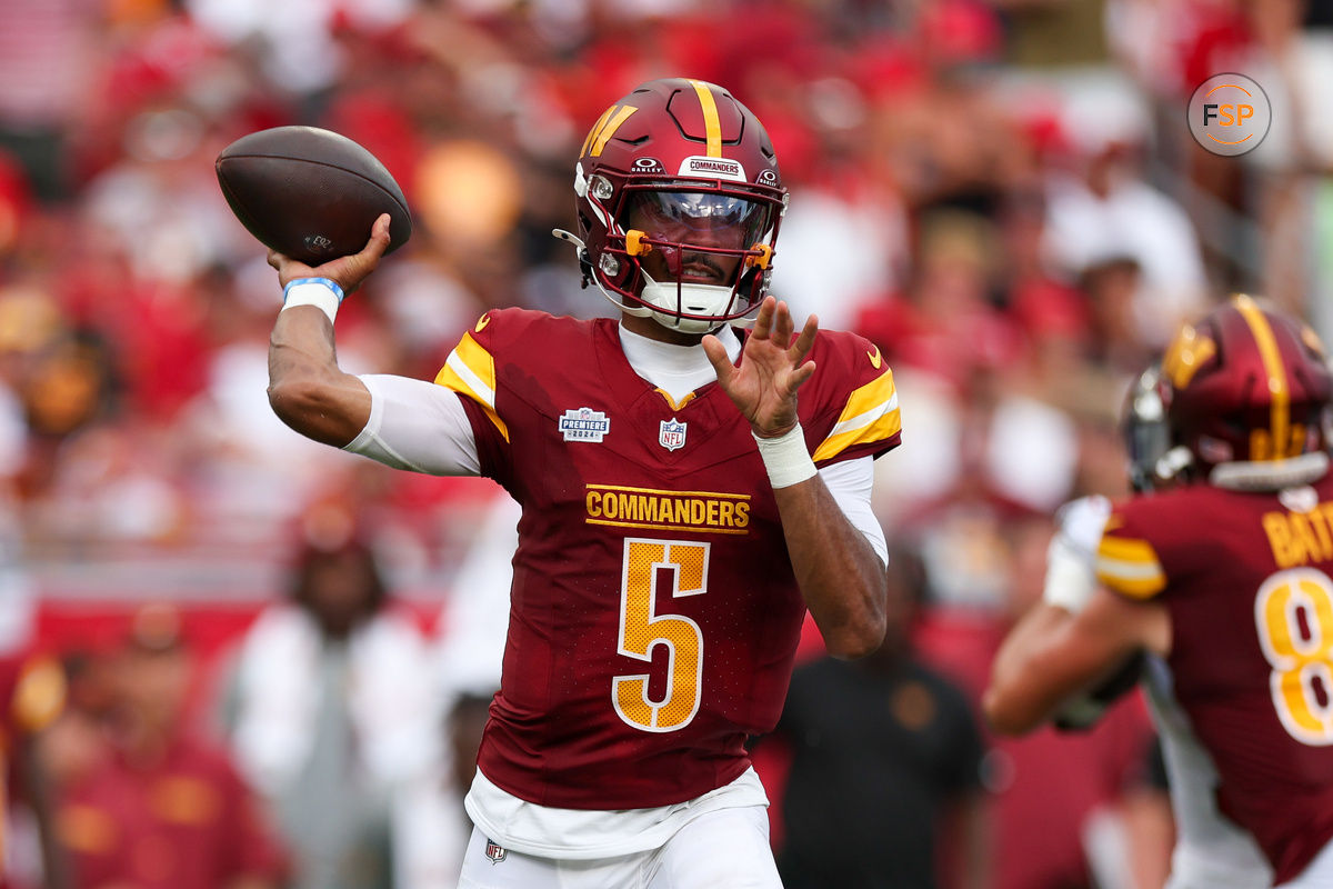 Sep 8, 2024; Tampa, Florida, USA; Washington Commanders quarterback Jayden Daniels (5) drops back to pass against the Tampa Bay Buccaneers in the third quarter at Raymond James Stadium. Credit: Nathan Ray Seebeck-Imagn Images