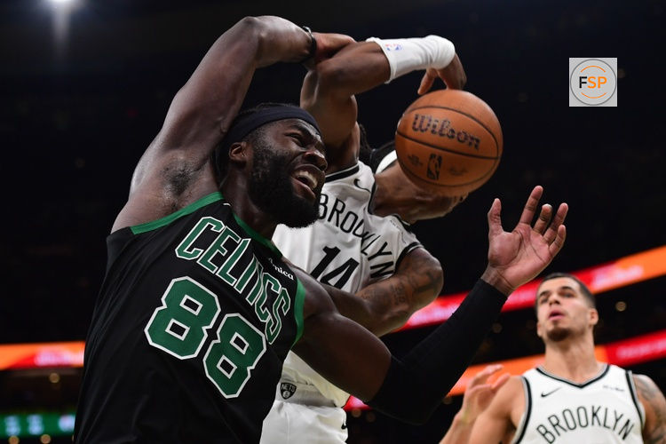 Nov 21, 2025; Boston, Massachusetts, USA; Brooklyn Nets guard Terance Mann (14) and Boston Celtics center Neemias Queta (88) battle for the ball during the second half at TD Garden. Credit: Bob DeChiara-Imagn Images