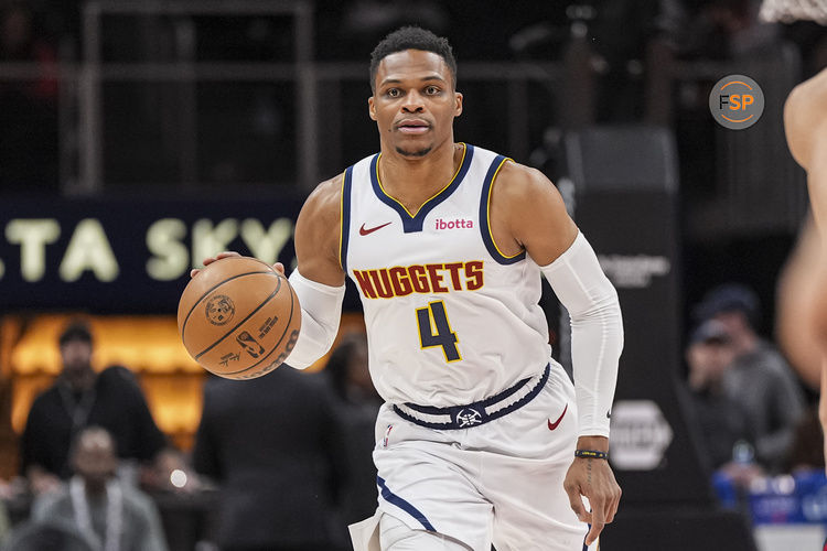 Dec 8, 2024; Atlanta, Georgia, USA; Denver Nuggets guard Russell Westbrook (4) brings the ball up the court against the Atlanta Hawks during the first half at State Farm Arena. Credit: Dale Zanine-Imagn Images