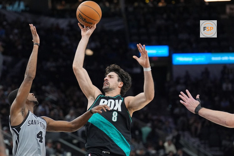 Jan 3, 2026; San Antonio, Texas, USA;  Portland Trail Blazers forward Deni Avdija (8) shoots over San Antonio Spurs guard De'aaron Fox (4) in the second half at Frost Bank Center. Credit: Daniel Dunn-Imagn Images