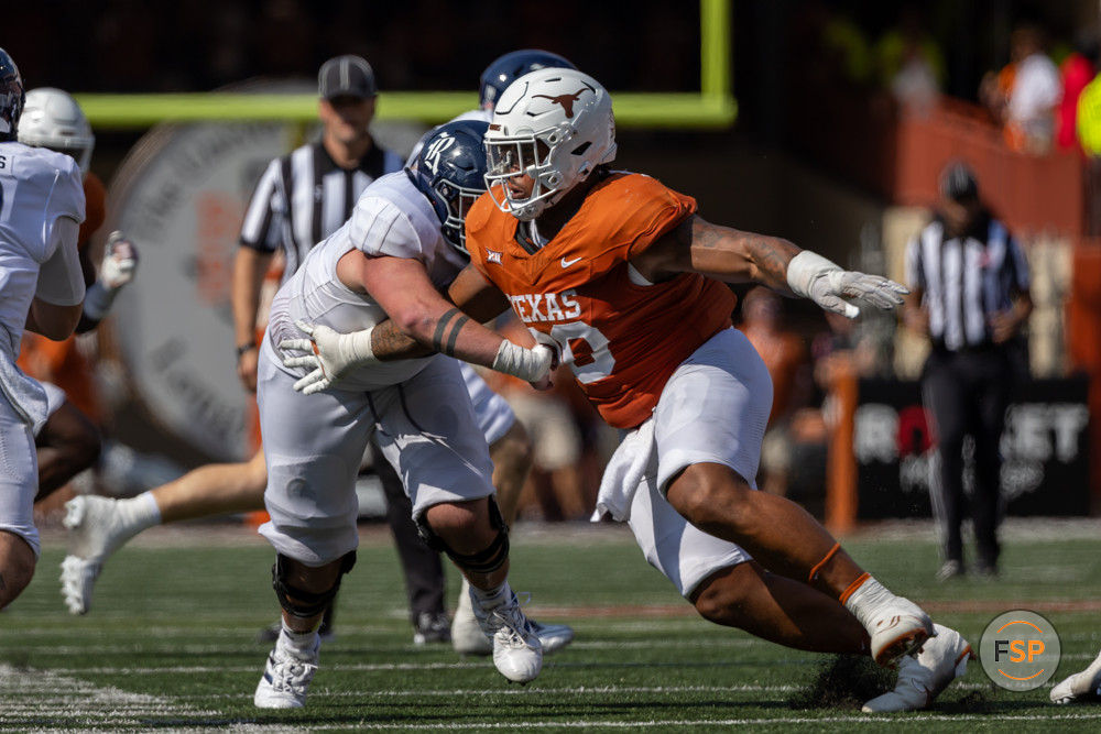 AUSTIN, TX - SEPTEMBER 02: Texas Longhorns defensive lineman Byron Murphy II (90) rushes around the offensive lineman during the college football game between Texas Longhorns and Rice Owls on September 2, 2023, at Darrell K Royal-Texas Memorial Stadium in Austin, TX.  (Photo by David Buono/Icon Sportswire)