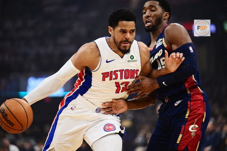 May 11, 2026; Cleveland, Ohio, USA; Detroit Pistons forward Tobias Harris (12) drives to the basket against Cleveland Cavaliers guard Donovan Mitchell (45) during the first quarter of game four in the second round of the 2026 NBA Playoffs at Rocket Arena. Credit: Ken Blaze-Imagn Images