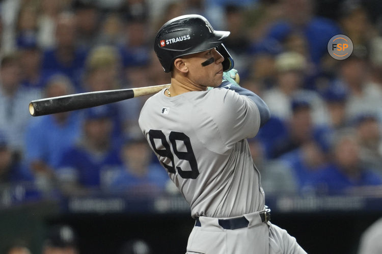 Oct 10, 2024; Kansas City, Missouri, USA; New York Yankees outfielder Aaron Judge (99) hits a double during the sixth inning against the Kansas City Royals during game four of the ALDS for the 2024 MLB Playoffs at Kauffman Stadium. Credit: Jay Biggerstaff-Imagn Images