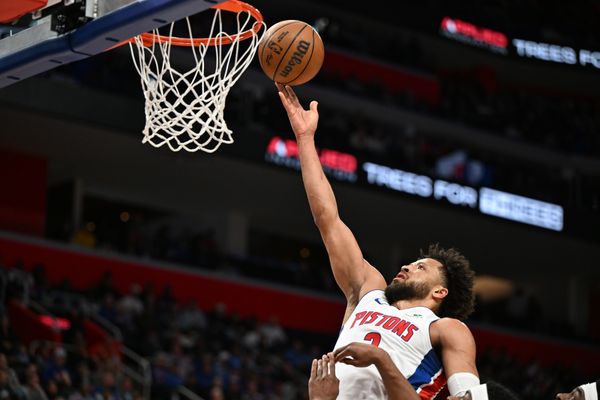 Mar 12, 2026; Detroit, Michigan, USA;  Detroit Pistons guard Cade Cunningham (2) puts in a layup against the Philadelphia 76ers in the first half at Little Caesars Arena. Mandatory Credit: Lon Horwedel-Imagn Images