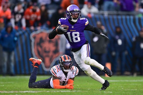 Nov 24, 2024; Chicago, Illinois, USA; Minnesota Vikings wide receiver Justin Jefferson (18) runs after a catch against the Chicago Bears during overtime at Soldier Field. Mandatory Credit: Daniel Bartel-Imagn Images