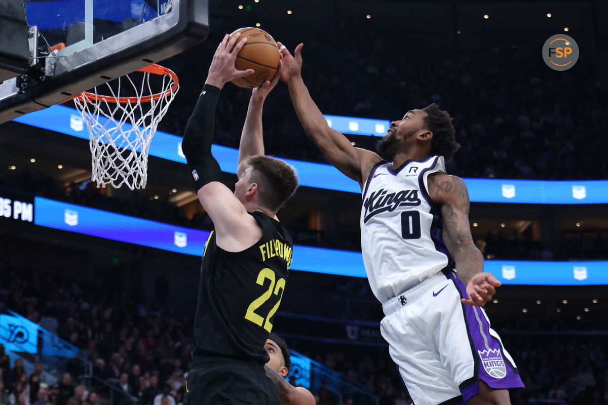 Oct 29, 2024; Salt Lake City, Utah, USA; Sacramento Kings guard Malik Monk (0) blocks the shot of Utah Jazz forward Kyle Filipowski (22) during the third quarter at Delta Center. Credit: Rob Gray-Imagn Images