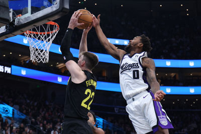 Oct 29, 2024; Salt Lake City, Utah, USA; Sacramento Kings guard Malik Monk (0) blocks the shot of Utah Jazz forward Kyle Filipowski (22) during the third quarter at Delta Center. Mandatory Credit: Rob Gray-Imagn Images