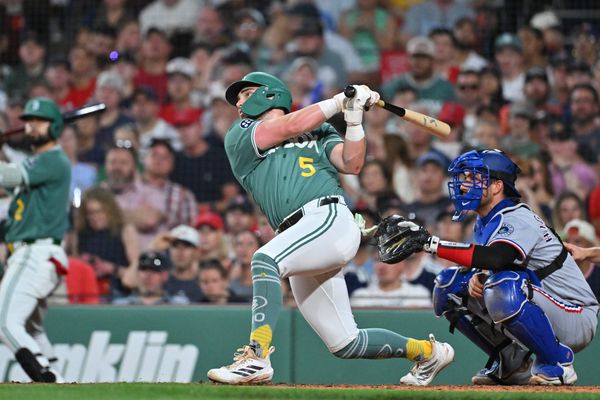 Jun 12, 2026; Boston, Massachusetts, USA; Boston Red Sox third baseman Caleb Durbin (5) hits a sacrifice fly ball to bring first baseman Willson Contreras (40) (not pictured) in for a run against the Texas Rangers during the fifth inning at Fenway Park. Mandatory Credit: Eric Canha-Imagn Images