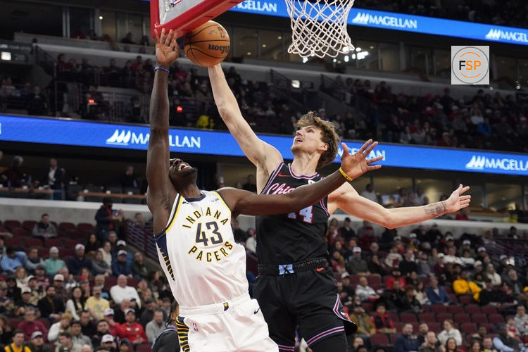 Dec 5, 2025; Chicago, Illinois, USA; Chicago Bulls forward Matas Buzelis (14) blocks the shot of Indiana Pacers forward Pascal Siakam (43) during the first half at United Center. Credit: David Banks-Imagn Images