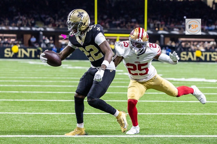Sep 14, 2025; New Orleans, Louisiana, USA;  New Orleans Saints wide receiver Rashid Shaheed (22) scores a touchdown against San Francisco 49ers safety Jason Pinnock (25) during the second half at Caesars Superdome. Credit: Stephen Lew-Imagn Images