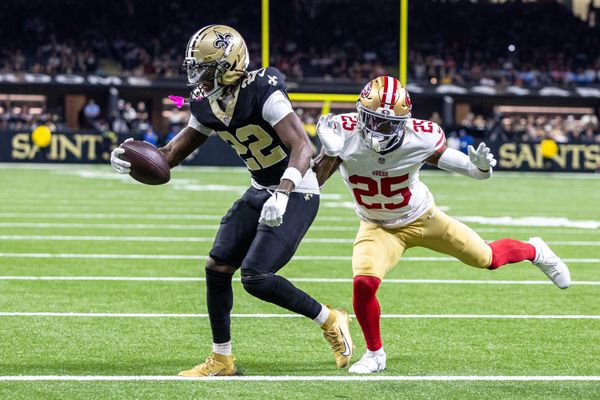 Sep 14, 2025; New Orleans, Louisiana, USA;  New Orleans Saints wide receiver Rashid Shaheed (22) scores a touchdown against San Francisco 49ers safety Jason Pinnock (25) during the second half at Caesars Superdome. Mandatory Credit: Stephen Lew-Imagn Images