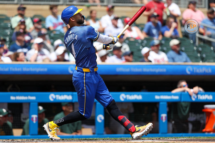 Jun 16, 2024; Minneapolis, Minnesota, USA; Minnesota Twins shortstop Carlos Correa (4) hits a two-run home run against the Oakland Athletics during the first inning of game one of a double header at Target Field. Credit: Matt Krohn-USA TODAY Sports