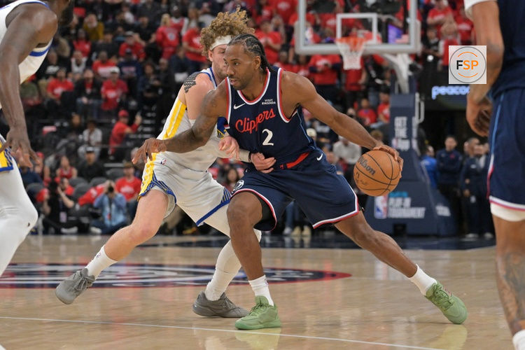Apr 15, 2026; Inglewood, California, USA; Golden State Warriors guard Brandin Podziemski (2) defends Los Angeles Clippers forward Kawhi Leonard (2) as he drives to the basket in the first half during the play-in rounds of the 2026 NBA Playoffs at Intuit Dome. Credit: Jayne Kamin-Oncea-Imagn Images