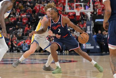 Apr 15, 2026; Inglewood, California, USA; Golden State Warriors guard Brandin Podziemski (2) defends Los Angeles Clippers forward Kawhi Leonard (2) as he drives to the basket in the first half during the play-in rounds of the 2026 NBA Playoffs at Intuit Dome. Mandatory Credit: Jayne Kamin-Oncea-Imagn Images