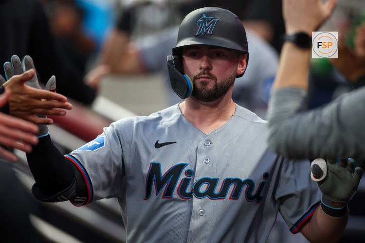 Apr 13, 2026; Atlanta, Georgia, USA; Miami Marlins catcher Liam Hicks (34) celebrates with teammates after driving in a run against the Atlanta Braves in the fourth inning at Truist Park. Credit: Brett Davis-Imagn Images