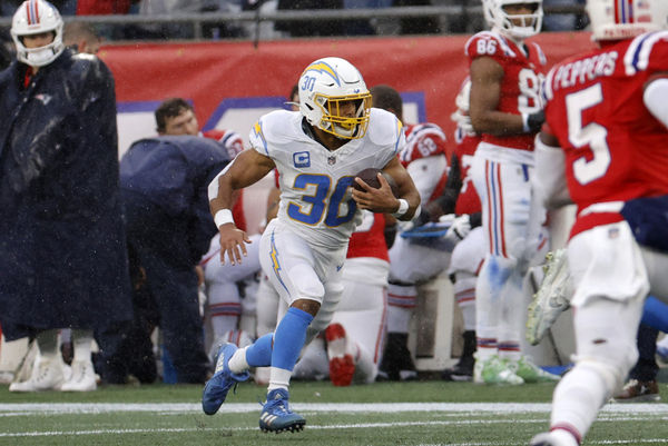 FOXBOROUGH, MA - DECEMBER 03: Los Angeles Chargers running back Austin Ekeler (30) runs with the ball during a game between the New England Patriots and the Los Angeles Chargers on December 3, 2023, at Gillette Stadium in Foxborough, Massachusetts. (Photo by Fred Kfoury III/Icon Sportswire)