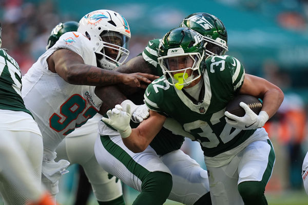 Dec 8, 2024; Miami Gardens, Florida, USA; New York Jets running back Isaiah Davis (32) rushes with the bal for a touchdown against the Miami Dolphins  during the first half at Hard Rock Stadium. Mandatory Credit: Jasen Vinlove-Imagn Images