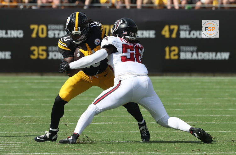 Sep 13, 2026; Pittsburgh, Pennsylvania, USA;  Pittsburgh Steelers running back Rico Dowdle (13) runs after a catch against Atlanta Falcons linebacker Harold Perkins Jr. (56) during the third quarter at Acrisure Stadium.  Credit: Charles LeClaire-Imagn Images