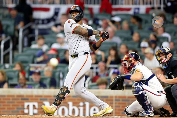 ATLANTA, GA - JULY 04: San Francisco Giants designated hitter Jorge Soler (2) hits a foul ball right at the photo well during the Thursday evening MLB game between the Atlanta Braves and the San Francisco Giants on July 4, 2024 at Truist Park in Atlanta, Georgia.  (Photo by David J. Griffin/Icon Sportswire)