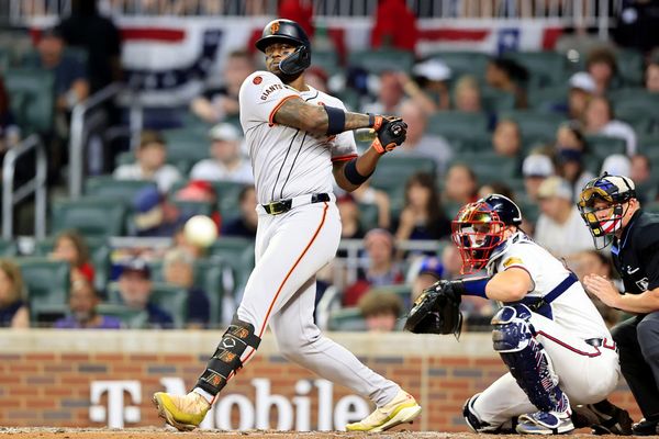 ATLANTA, GA - JULY 04: San Francisco Giants designated hitter Jorge Soler (2) hits a foul ball right at the photo well during the Thursday evening MLB game between the Atlanta Braves and the San Francisco Giants on July 4, 2024 at Truist Park in Atlanta, Georgia.  (Photo by David J. Griffin/Icon Sportswire)