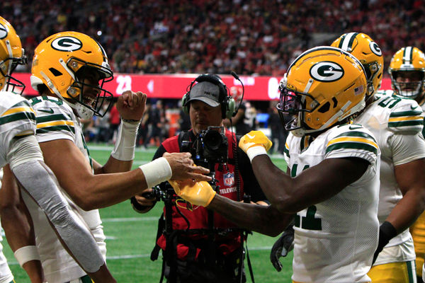 ATLANTA, GA - SEPTEMBER 17: Green Bay Packers wide receiver Jayden Reed #11 celebrates with Green Bay Packers quarterback Jordan Love #10 after scoring during the NFL game between the Green Bay Packers and the Atlanta Falcons on September 17, 2023 at Mercedes-Benz Stadium in Atlanta, GA.  (Photo by Jeff Robinson/Icon Sportswire)