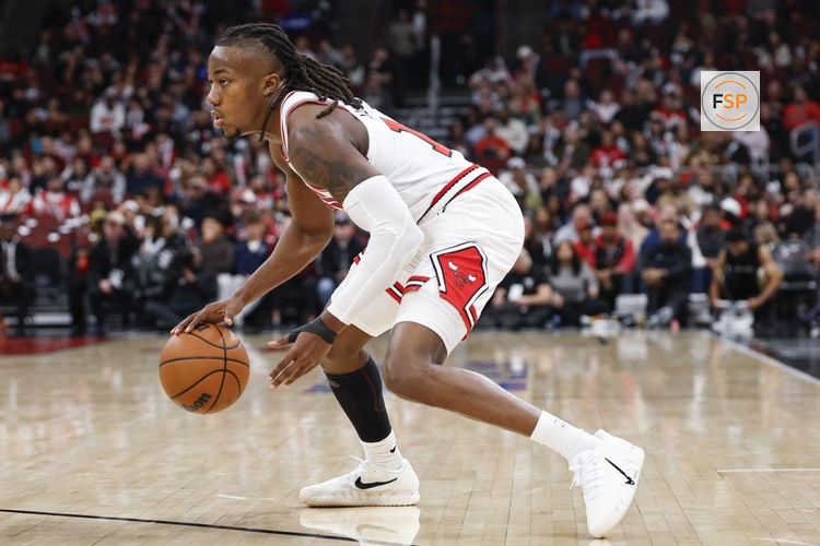 Nov 22, 2025; Chicago, Illinois, USA; Chicago Bulls guard Ayo Dosunmu (11) drives to the basket against the Washington Wizards during the first half at United Center. Credit: Kamil Krzaczynski-Imagn Images