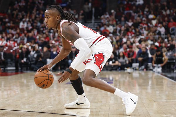 Nov 22, 2025; Chicago, Illinois, USA; Chicago Bulls guard Ayo Dosunmu (11) drives to the basket against the Washington Wizards during the first half at United Center. Mandatory Credit: Kamil Krzaczynski-Imagn Images