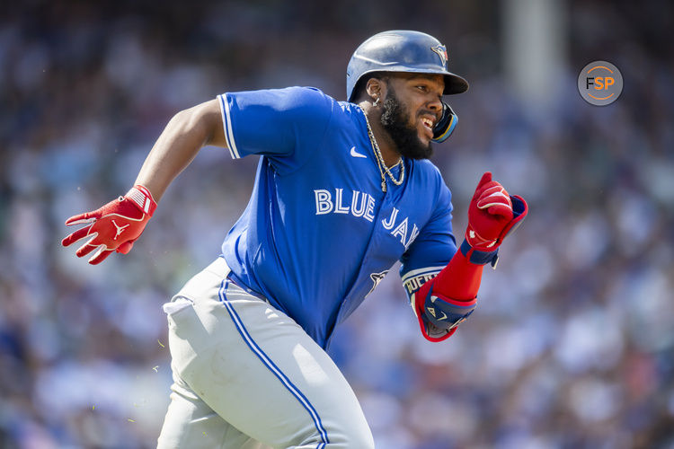 Aug 17, 2024; Chicago, Illinois, USA; Toronto Blue Jays first base Vladimir Guerrero Jr. (27) runs after hitting a double during the fourth inning against the Chicago Cubs at Wrigley Field. Credit: Patrick Gorski-USA TODAY Sports