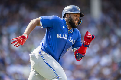 Aug 17, 2024; Chicago, Illinois, USA; Toronto Blue Jays first base Vladimir Guerrero Jr. (27) runs after hitting a double during the fourth inning against the Chicago Cubs at Wrigley Field. Mandatory Credit: Patrick Gorski-USA TODAY Sports