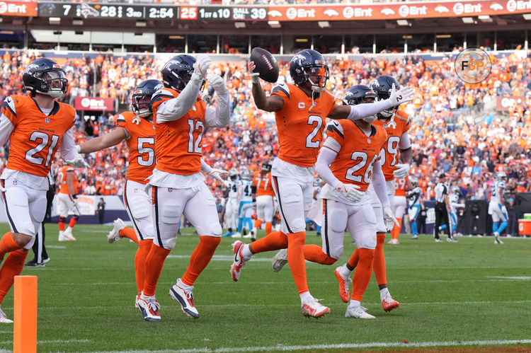 Oct 27, 2024; Denver, Colorado, USA; Denver Broncos cornerback Pat Surtain II (2) celebrates his interception with linebacker Kwon Alexander (12) and cornerback Riley Moss (21) and safety Devon Key (26) in the second half against the Carolina Panthers at Empower Field at Mile High. Credit: Ron Chenoy-Imagn Images