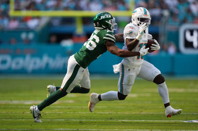 Dec 8, 2024; Miami Gardens, Florida, USA; New York Jets cornerback Brandin Echols (26) attempts to tackle Miami Dolphins wide receiver Tyreek Hill (10) during the first half at Hard Rock Stadium. Mandatory Credit: Jasen Vinlove-Imagn Images