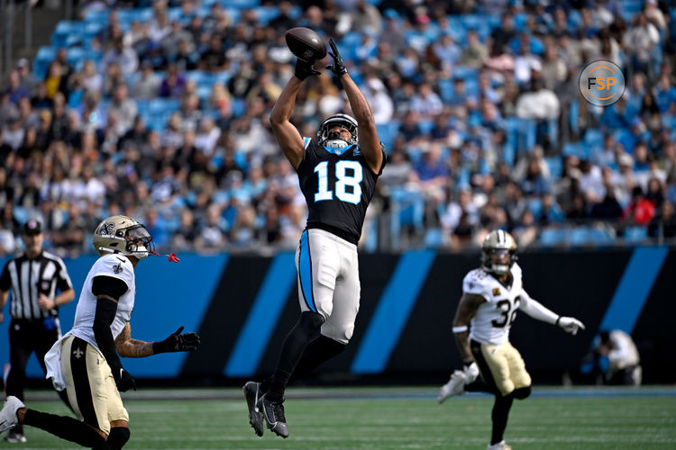 Nov 3, 2024; Charlotte, North Carolina, USA; Carolina Panthers wide receiver Jalen Coker (18) catches the ball as New Orleans Saints cornerback Alontae Taylor (1) defends in the first qarter at Bank of America Stadium. Credit: Bob Donnan-Imagn Images