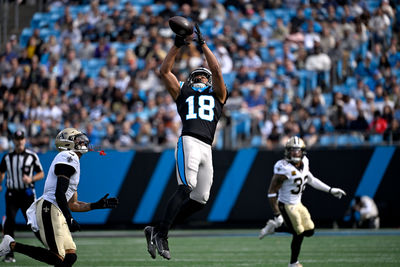 Nov 3, 2024; Charlotte, North Carolina, USA; Carolina Panthers wide receiver Jalen Coker (18) catches the ball as New Orleans Saints cornerback Alontae Taylor (1) defends in the first qarter at Bank of America Stadium. Mandatory Credit: Bob Donnan-Imagn Images