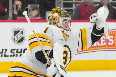 Apr 7, 2026; Raleigh, North Carolina, USA;  Boston Bruins goaltender Jeremy Swayman (1) makes a glove save against the Carolina Hurricanes during the first period at Lenovo Center. Mandatory Credit: James Guillory-Imagn Images