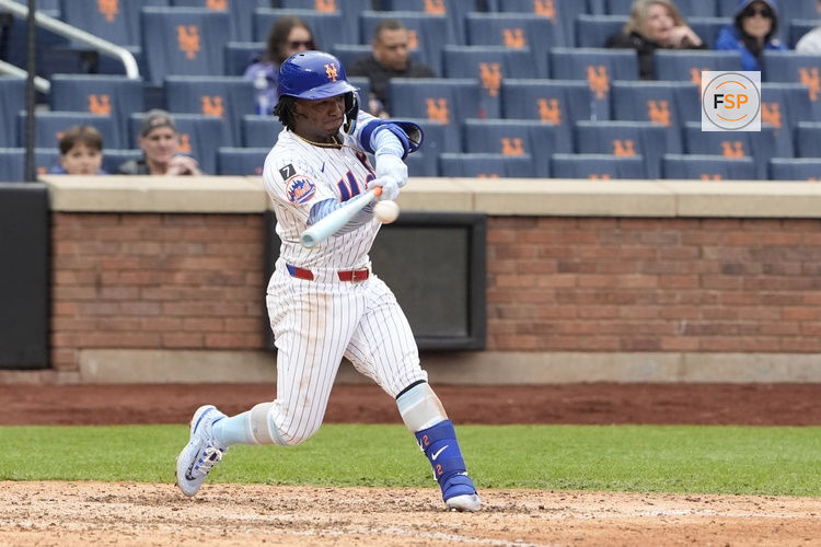 Jun 15, 2025; New York City, New York, USA;  New York Mets shortstop Luisangel Acuna (2) hits a single against the Tampa Bay Rays during the ninth inning at Citi Field. Credit: Gregory Fisher-Imagn Images