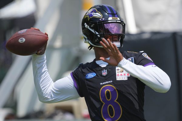 Jul 23, 2025; Owings Mills, MD, USA; Baltimore Ravens quarterback Lamar Jackson (8) warms up during training camp at Under Armour Performance Center. Mandatory Credit: Mitch Stringer-Imagn Images