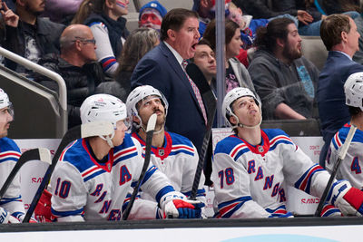 Mar 29, 2025; San Jose, California, USA; New York Rangers head coach Peter Laviolette instructs his team as left wings Artemi Panarin (10), Chris Kreider (20) and Brennan Othmann (78) look on against the San Jose Sharks during the third period at SAP Center at San Jose. Mandatory Credit: Robert Edwards-Imagn Images