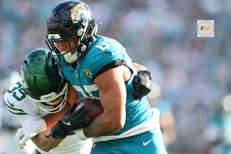 Dec 14, 2025; Jacksonville, Florida, USA; New York Jets safety Dean Clark (35) tackles Jacksonville Jaguars tight end Brenton Strange (85) during the third quarter at EverBank Stadium. Credit: Morgan Tencza-Imagn Images