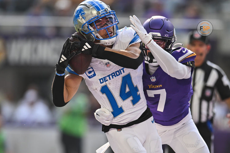 Oct 20, 2024; Minneapolis, Minnesota, USA; Detroit Lions wide receiver Amon-Ra St. Brown (14) catches a 35 yard touchdown pass from quarterback Jared Goff (not pictured) as Minnesota Vikings cornerback Byron Murphy Jr. (7) defends during the second quarter at U.S. Bank Stadium. Credit: Jeffrey Becker-Imagn Images