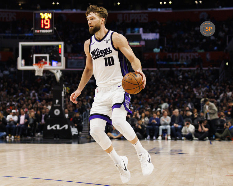 LOS ANGELES, CA - DECEMBER 12: Sacramento Kings forward Domantas Sabonis (10) dribbles during an NBA basketball game against the LA Clippers on December 12, 2023 at Crypto.com Arena in Los Angeles, CA. (Photo by Ric Tapia/Icon Sportswire)