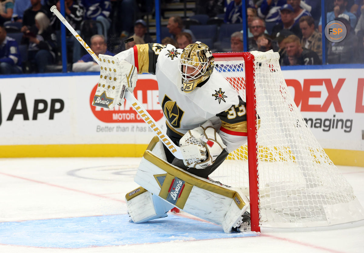 wOct 17, 2024; Tampa, Florida, USA; Vegas Golden Knights goaltender Adin Hill (33) makes a save against the Tampa Bay Lightning  during the third period at Amalie Arena. Credit: Kim Klement Neitzel-Imagn Images