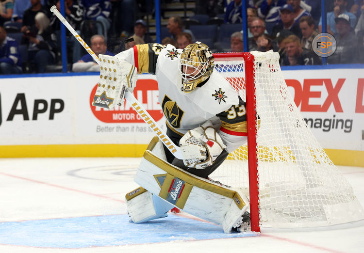 wOct 17, 2024; Tampa, Florida, USA; Vegas Golden Knights goaltender Adin Hill (33) makes a save against the Tampa Bay Lightning  during the third period at Amalie Arena. Credit: Kim Klement Neitzel-Imagn Images