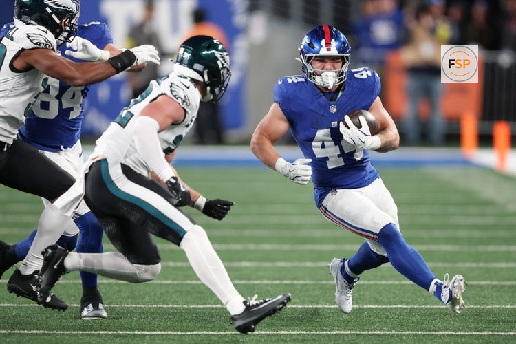 Oct 9, 2025; East Rutherford, New Jersey, USA; New York Giants running back Cam Skattebo (44) carries the ball against the Philadelphia Eagles during the second quarter of the game at MetLife Stadium. Credit: Vincent Carchietta-Imagn Images